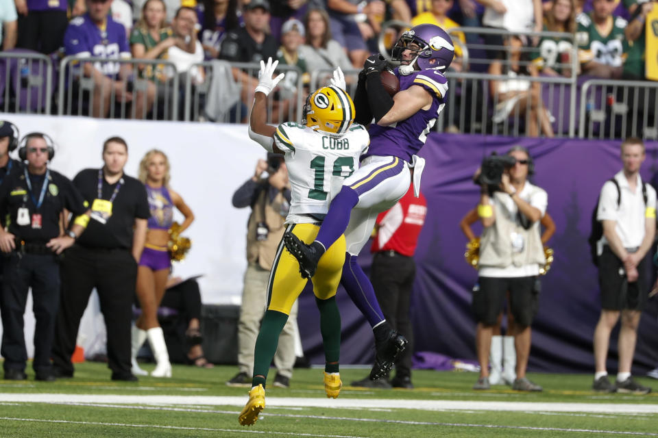Minnesota Vikings safety Harrison Smith (22) intercepts a pass over Green Bay Packers wide receiver Randall Cobb (18) during the first half of an NFL football game, Sunday, Sept. 11, 2022, in Minneapolis. (AP Photo/Bruce Kluckhohn)