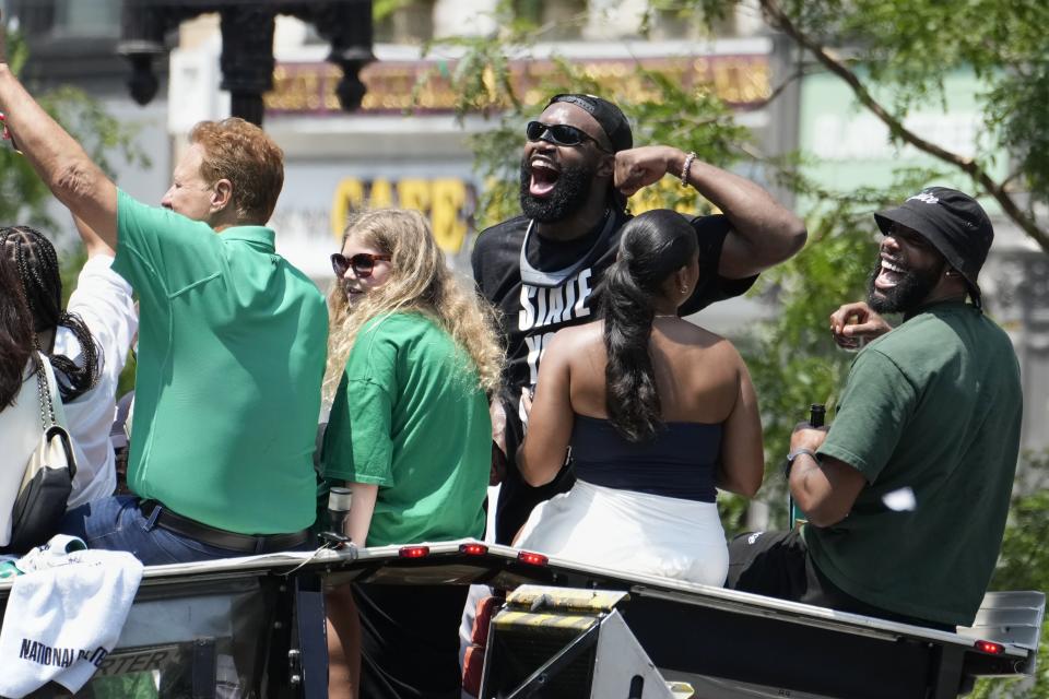 Boston Celtics NBA basketball championship MVP Jaylen Brown, center, celebrates during a duck boat parade Friday, June 21, 2024, in Boston. (AP Photo/Michael Dwyer)