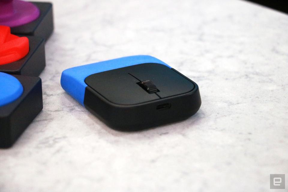 <p>The Microsoft Adaptive Mouse with a blue 3D-printed palmrest attached.</p>
