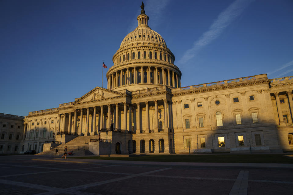 The Capitol is seen at dawn as a consequential week begins in Washington for President Joe Biden and Democratic leaders in Congress who are trying to advance his $3.5 trillion "Build Back Better" and pass legislation to avoid a federal shutdown, Monday, Sept. 27, 2021. (AP Photo/J. Scott Applewhite)