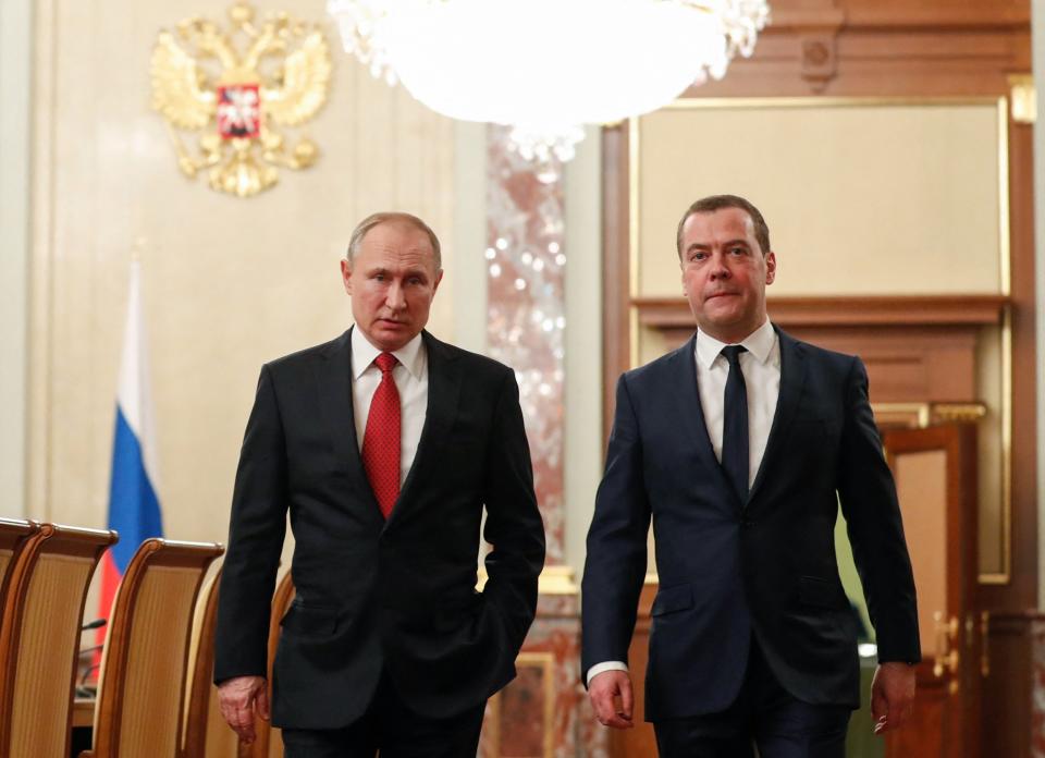 Russian President Vladimir Putin and Prime Minister Dmitry Medvedev before a meeting with members of the government in Moscow on Jan. 15, 2020. 