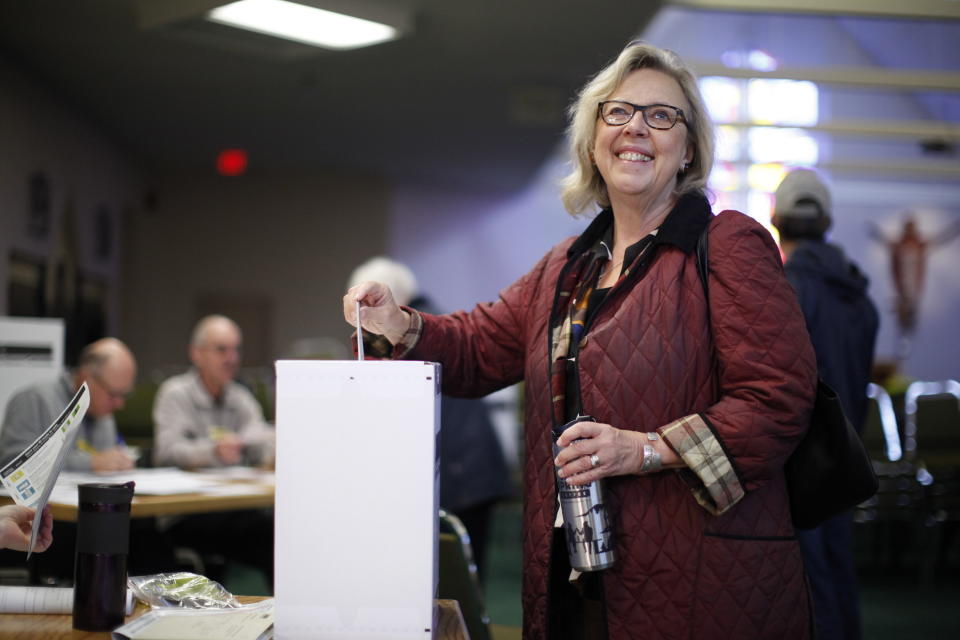 Green Party Leader Elizabeth May casts her vote at St. Elizabeth's Parish while in Sidney, British Columbia Monday, Oct. 21, 2019. (Chad Hipolito/The Canadian Press via AP)