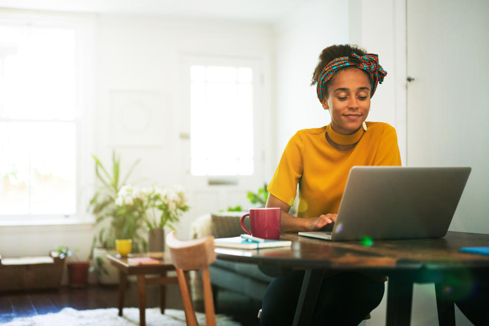 Woman using laptop in home