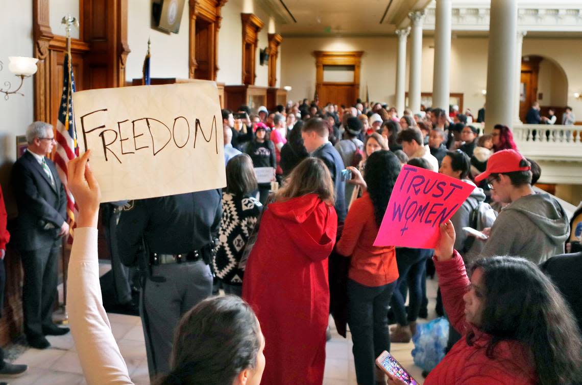 Protesters opposed to a proposed abortion bill fill the hallway in the Capitol in Atlanta.