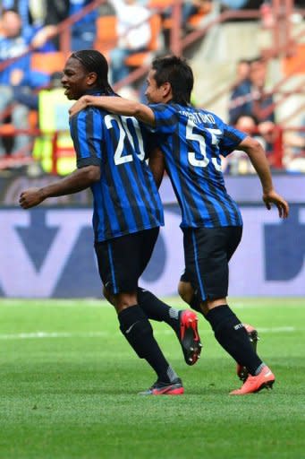 Inter Milan's Joel Obi (L) celebrates after scoring with Inter Milan's Japanese midfielder Yuto Nagatomo during their Serie A football match between Inter Milan and Cesena at San Siro Stadium in Milan on April 29