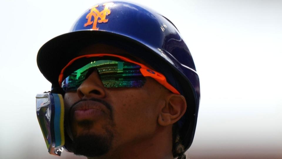 New York Mets shortstop Francisco Lindor (12) walks backk to the dugout after striking out the first inning of a baseball game between the New York Mets and the Cincinnati Reds, Thursday, May 11, 2023, in Cincinnati.