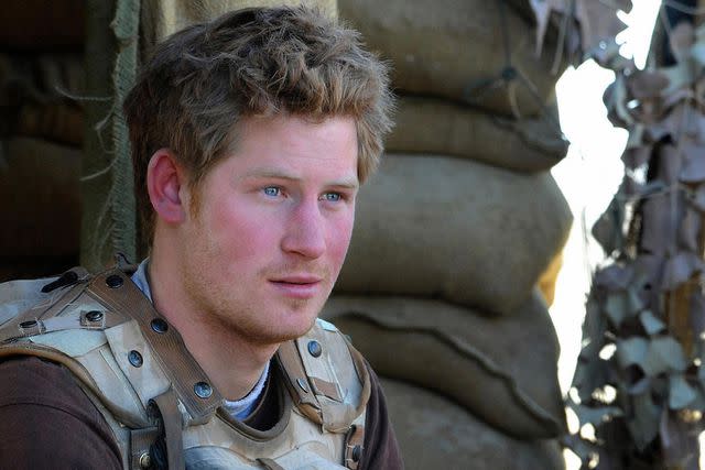 <p>JOHN STILLWELL/AFP via Getty</p> Prince Harry serving in Afghanistan, 2008