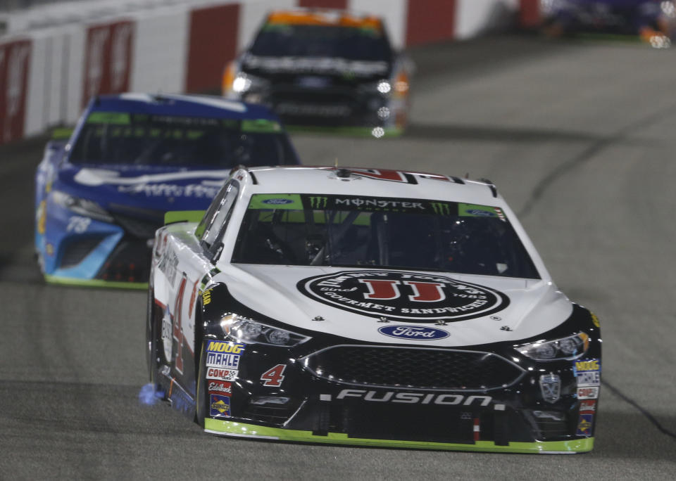 Kevin Harvick (4) drives into turn one during the NASCAR Cup Series auto race at Richmond Raceway in Richmond, Va., Saturday, Sept. 22, 2018. (AP Photo/Steve Helber)
