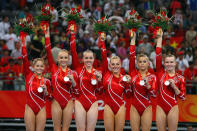 (L-R) Shawn Johnson, Nastia Liukin, Chellsie Memmel, Samantha Peszek, Alicia Sacramone and Bridget Sloan of the United States women's gymnastics team celebrates after receiving the silver medal in the artistic gymnastics team event at the National Indoor Stadium during Day 5 of the Beijing 2008 Olympic Games on August 13, 2008 in Beijing, China.