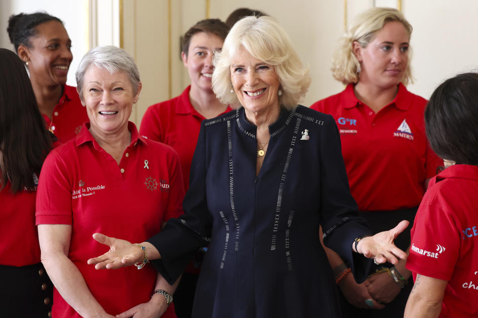 FILE - Britain's Queen Camilla poses for a picture with members of the Maiden Yachting Crew. Queen Camilla hosts the 'Maiden' Yachting Crew following their Global Ocean Race Win at Clarence House on April 29, 2024 in London. Camilla has emerged as one of the monarchy’s most prominent emissaries. Increasing her schedule of appearances, the queen played a crucial role in keeping the royal family in the public eye. (Chris Jackson, Pool Photo via AP, File)