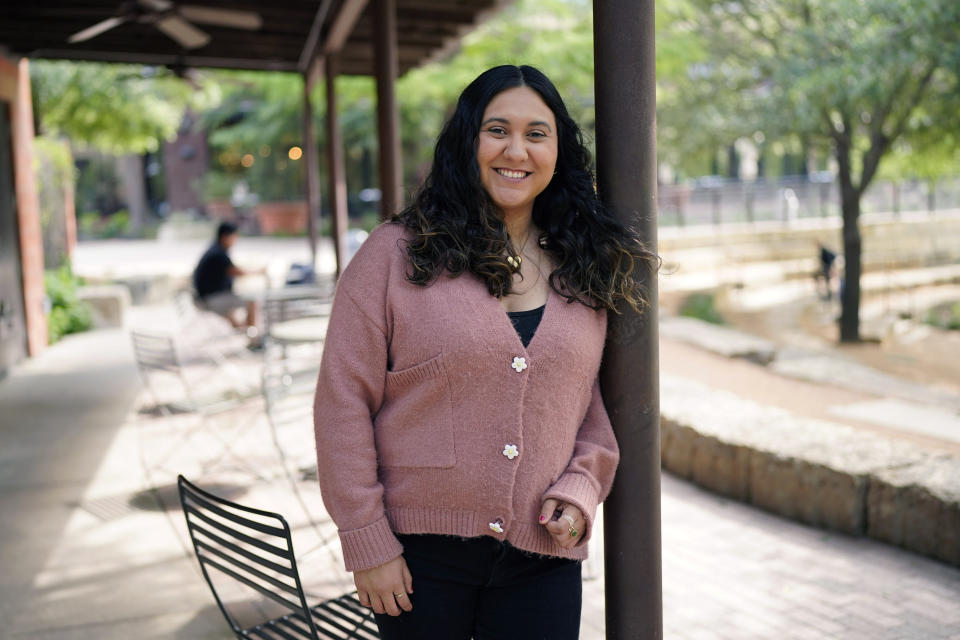 Sarah Lopez, who volunteers with a women's rights organization called For Her, poses for a photo at the site where the group meets, Wednesday, April 5, 2023, in San Antonio. Lopez was invited by the nonprofit to go through a leadership training program, meant to develop volunteers among the organization's participants. (AP Photo/Eric Gay)