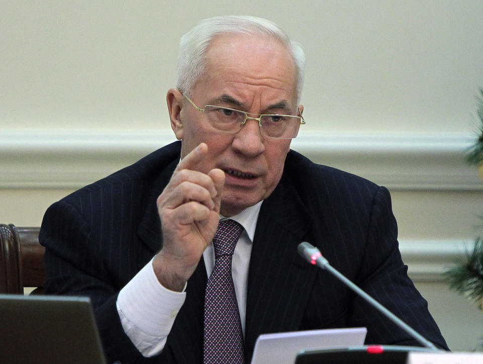 FILE - In this Wednesday, Dec. 18, 2013 file photo, Ukrainian Prime Minister Mykola Azarov gestures while speaking at a cabinet meeting in Kiev, Ukraine. The prime minister of crisis-torn Ukraine has submitted his resignation. In a statement Tuesday, Jan. 28, 2014 on the government website, Mykola Azarov offered his resignation in order to encourage what he called "social-political compromise." (AP Photo/Sergei Chuzavkov)