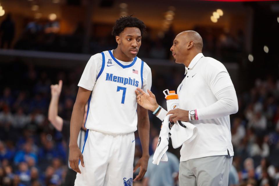 Memphis' Nae'Qwan Tomlin (7) speaks with head coach Penny Hardaway during the game between Florida Atlantic University and University of Memphis at FedExForum in Memphis, Tenn., on Sunday, February 25, 2024.