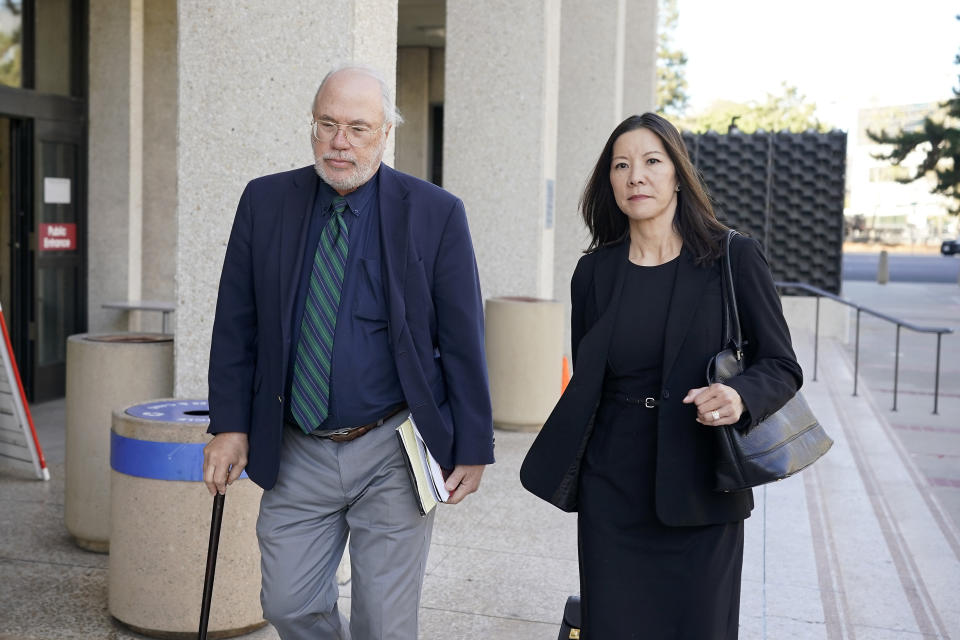 Geoffrey Carr, left, and May Mar, attorney's for Tiffany Li, walk out of the courthouse after opening statements were delayed in Li's trial, Thursday, Sept. 12, 2019, in Redwood City, Calif. Li, a Chinese real estate scion, posted a $35 million bail after being charged with orchestrating the 2016 murder of her children's father. (AP Photo/Tony Avelar)