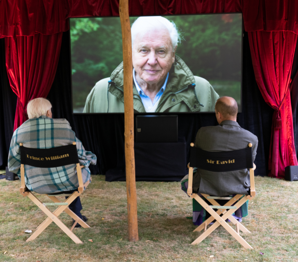 Sir David and William watch the broadcaster’s new documentary – sat in the wrong chairs (Kensington Palace/PA)