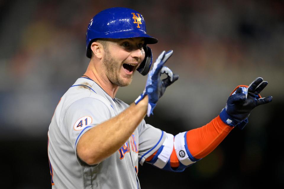 New York Mets' Pete Alonso gestures at third after he hit an RBI triple during the third inning of the team's baseball game against the Washington Nationals, Friday, Sept. 3, 2021, in Washington. (AP Photo/Nick Wass)