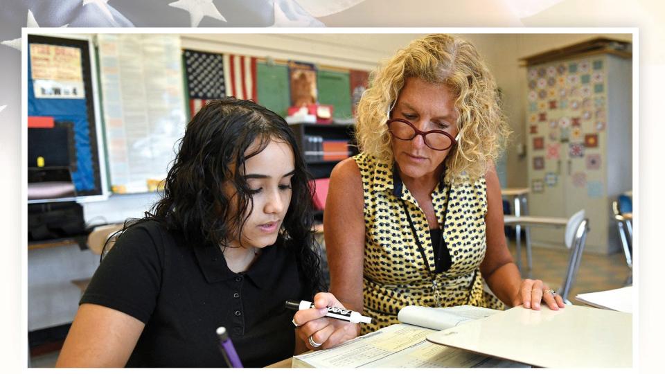 Sonya Bertini, a bilingual special ed teacher at Vineland High School in New Jersey, works with a student on Sept. 30, 2019.