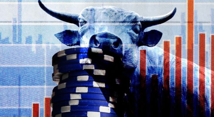 a bull next to a stack of blue gambling chips to represent blue-chip stocks