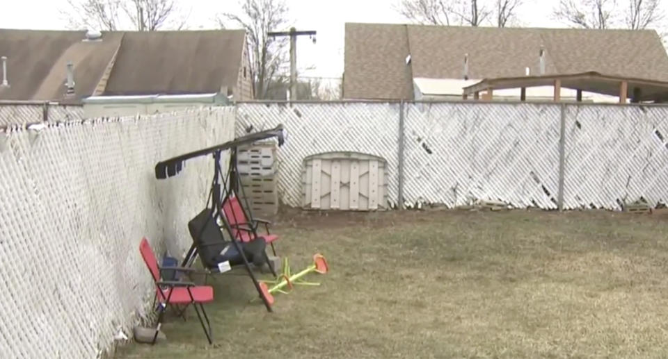 The backyard where three-year-old Aziz Ahmed was attacked by his neighbour's dogs.