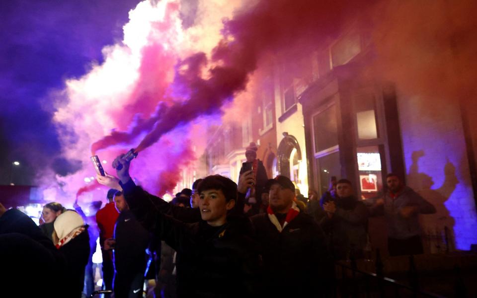 fans with flares - Reuters