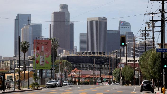 Downtown Los Angeles skyline in the background shown from the Broadway and Bishops Rd. where residents are opposed to the proposed Doger Stadium gondola that will run past their homes along Bishops Rd. in the Solono Canyon neighborhood on Thursday, March 17, 2022 in Los Angeles, CA. <span class="copyright">Gary Coronado / Los Angeles Times via Getty Images</span>