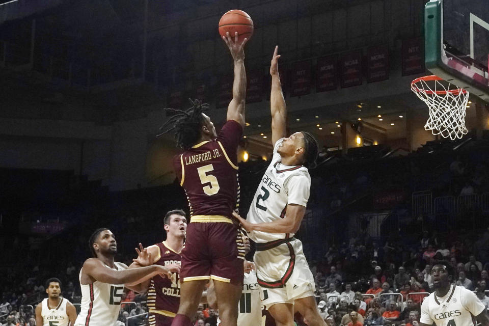 Boston College guard DeMarr Langford Jr. (5) aims for a basket as Miami guard Isaiah Wong (2) defends during the second half of an NCAA college basketball game, Wednesday, Jan. 11, 2023, in Coral Gables, Fla. (AP Photo/Marta Lavandier)