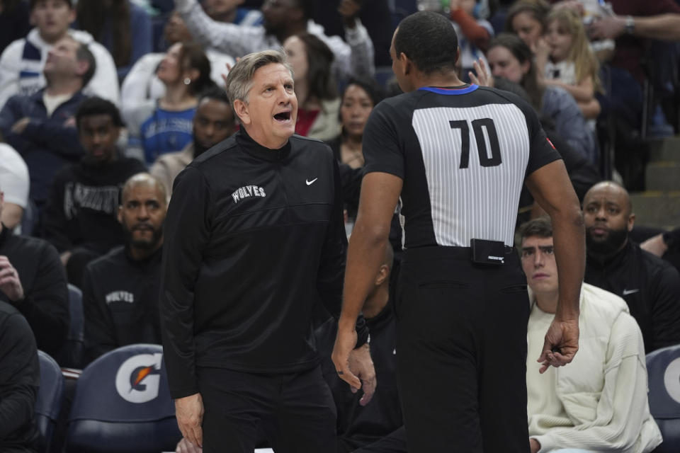 Minnesota Timberwolves head coach Chris Finch, left, reacts toward referee Phenizee Ransom (70) during the first half of an NBA basketball game against the Los Angeles Clippers, Sunday, March 3, 2024, in Minneapolis. (AP Photo/Abbie Parr)