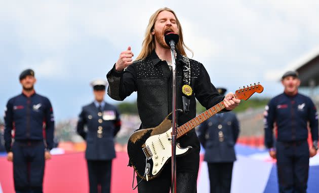 Musician Sam Ryder performs the British national anthem on the grid before the F1 Grand Prix of Great Britain on July 3 in Northampton, England. (Photo: Dan Mullan - Formula 1 via Getty Images)