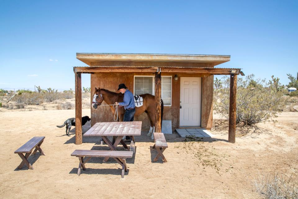 Jeff Eamer, a psychotherapist, moved from Los Angeles to Yucca Valley, where he now holds therapy sessions out in nature at Joey's Home Animal Rescue in Yucca Valley, Calif., on June 29, 2022. 