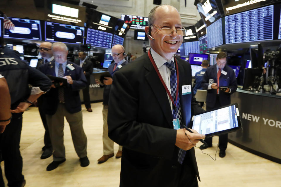 Trader Gordon Charlop smiles as he works on the floor of the New York Stock Exchange, Wednesday, Sept. 4, 2019. Stocks are opening higher on Wall Street following big gains in Asia as Hong Kong's government withdrew a controversial extradition law that set off three months of protests there. (AP Photo/Richard Drew)