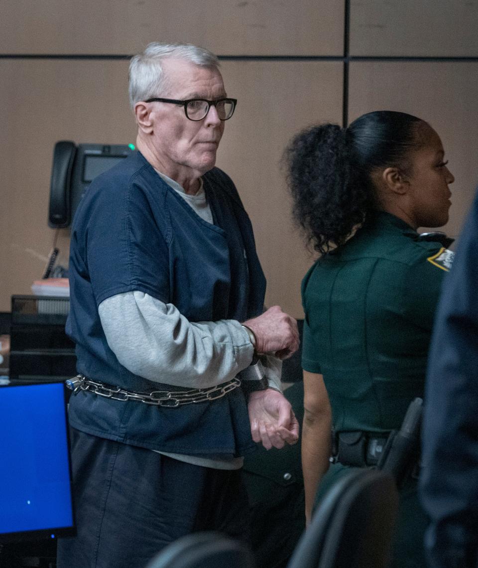 Stephen Kruspe is escorted out of the courtroom in the Palm Beach County Courthouse Monday after being sentenced to 20 years in prison, with credit for the six he has served since his arrest.