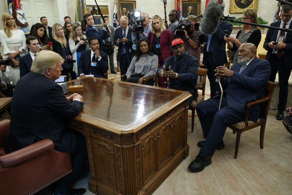 President Donald Trump meets with musician Kanye West and former football player Jim Brown in the Oval Office of the White House, Thursday, Oct. 11, 2018, in Washington. (AP Photo/Evan Vucci)
