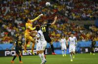 South Korea's goalkeeper Kim Seung-gyu saves the ball from a header by Belgium's Kevin Mirallas during their 2014 World Cup Group H soccer match at the Corinthians arena in Sao Paulo June 26, 2014. REUTERS/Ivan Alvarado