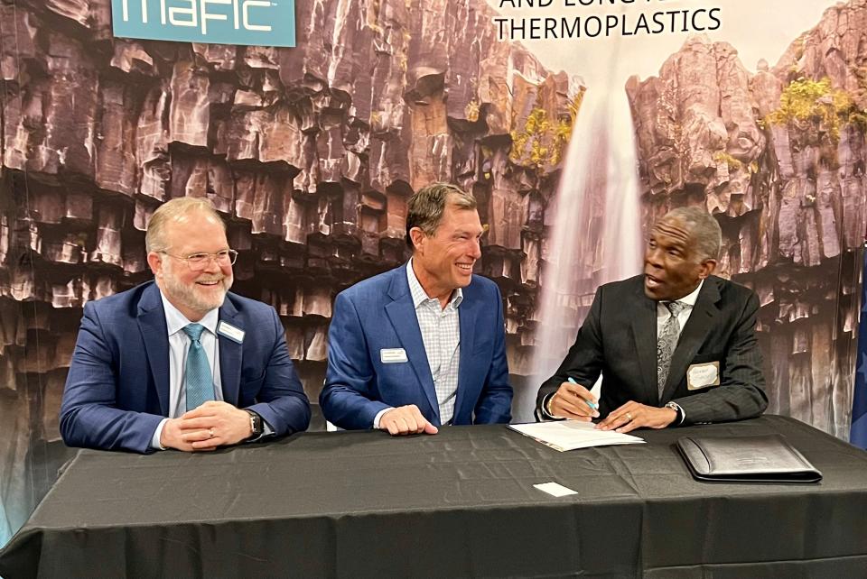 From left: Brett McMahon, investor at Mafic, Kevin McDonald, Mafic board of directors chair and Reginald Speight, USDA rural development state director, sign a $3 million loan for Mafic USA in Shelby.