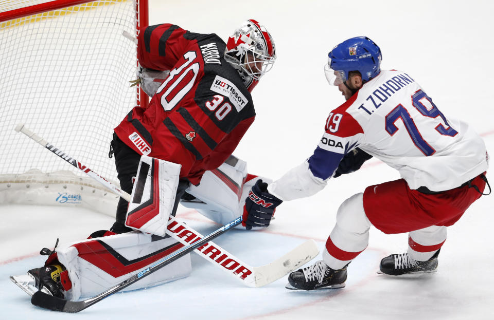 Canada's goaltender Matt Murray makes a save against Czech Republic's Tomas Zohorna, right, during the Ice Hockey World Championships semifinal match between Canada and Czech Republic at the Ondrej Nepela Arena in Bratislava, Slovakia, Saturday, May 25, 2019. (AP Photo/Petr David Josek)