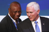 U.S. Vice President Mike Pence, right, speaks with APEC CEO Summit 2018 Chairman Isikeli Taureka during the APEC CEO Summit 2018 in Port Moresby, Papua New Guinea, Saturday, Nov. 17, 2018. (Fazry Ismail/Pool Photo via AP)