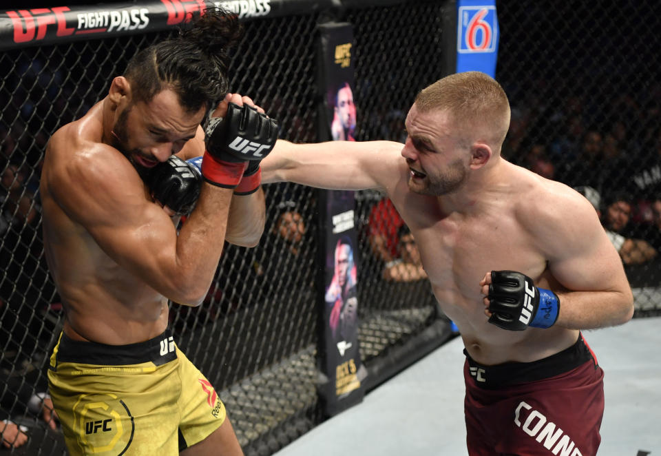 VANCOUVER, BRITISH COLUMBIA - SEPTEMBER 14:  (R-L) Tristan Connelly of Canada punches Michel Pereira of Brazil in their middleweight bout during the UFC Fight Night event at Rogers Arena on September 14, 2019 in Vancouver, Canada. (Photo by Jeff Bottari/Zuffa LLC/Zuffa LLC)