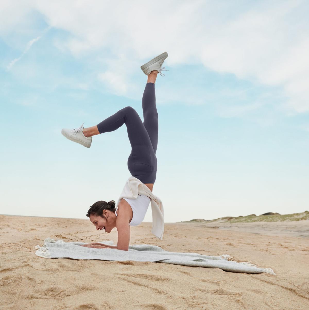 Christy Turlington Does a Forearm Stand On the Beach for Athleta's