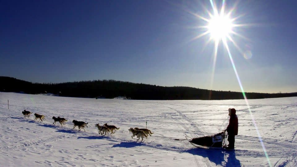 A sled dog team crosses Portage Lake in Portage, Maine, during the Can Am Crown 250 in 2001. - Robert F. Bukaty/AP