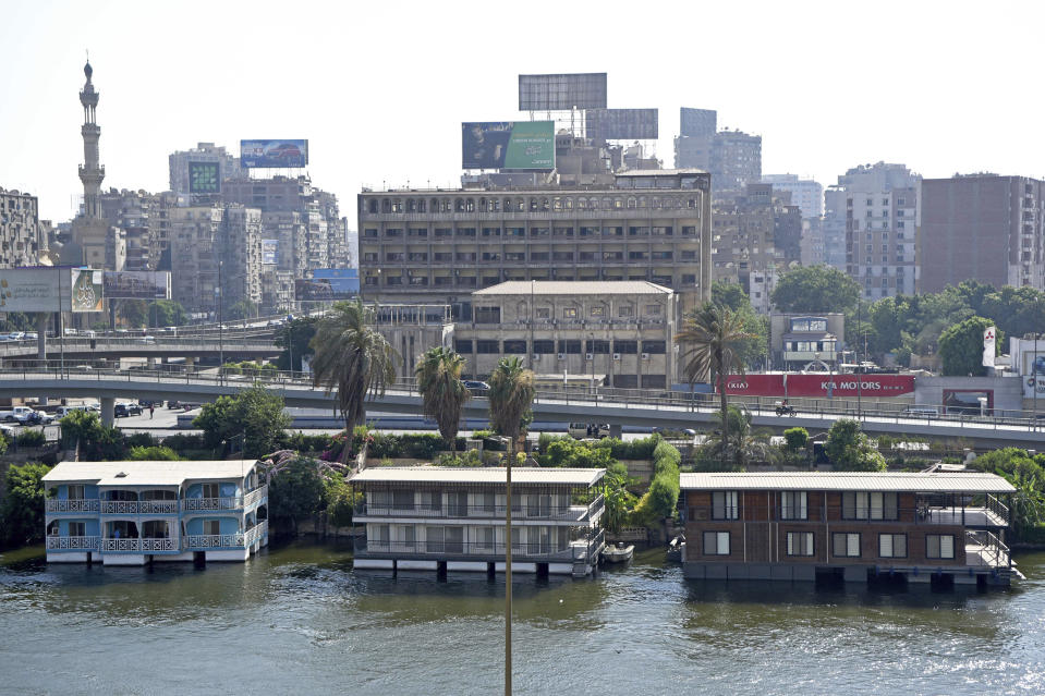 Several houseboats stand moored on the banks of the Nile River in Cairo, Egypt on June 27, 2022. A government push to remove the string of houseboats from Cairo’s Nile banks has dwindled their numbers from a several dozen to just a handful. The tradition of living on the Nile River dates back to the 1800s, and the removal of the boats has drawn criticism in Egypt. The government says it plans to develop the waterfront. (AP Photo/Tarek Wagih)