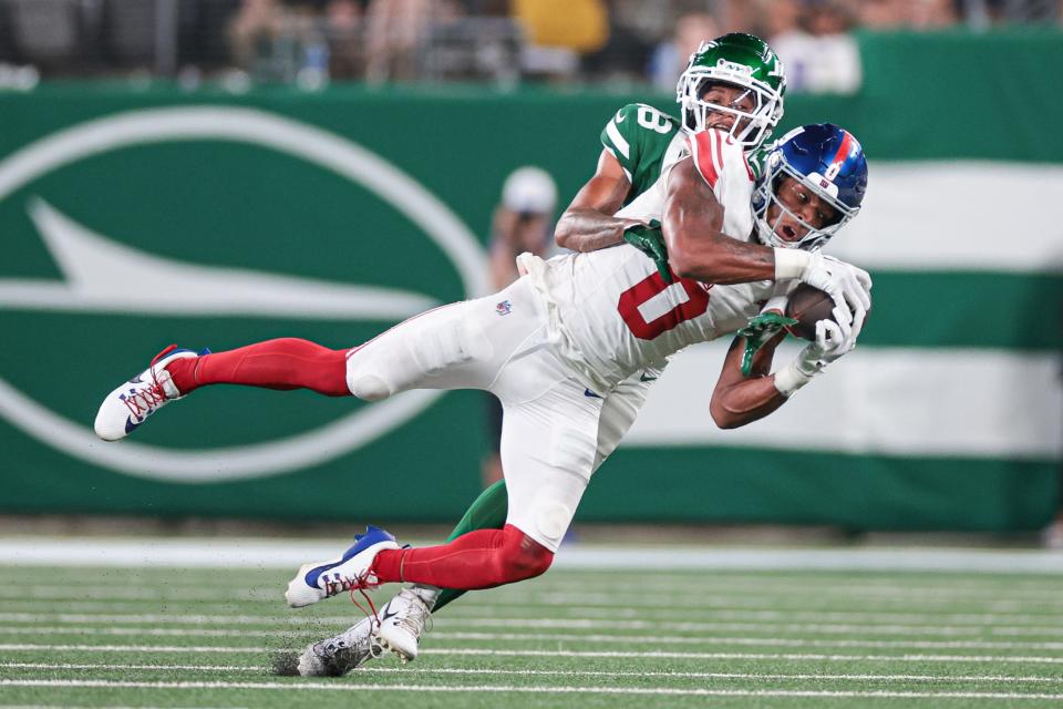 Aug 24, 2024; East Rutherford, New Jersey, USA; New York Jets defensive back Nehemiah Shelton (38) breaks up a pass intend for New York Giants wide receiver John Jiles (0) during the second half at MetLife Stadium. Mandatory Credit: Vincent Carchietta-USA TODAY Sports