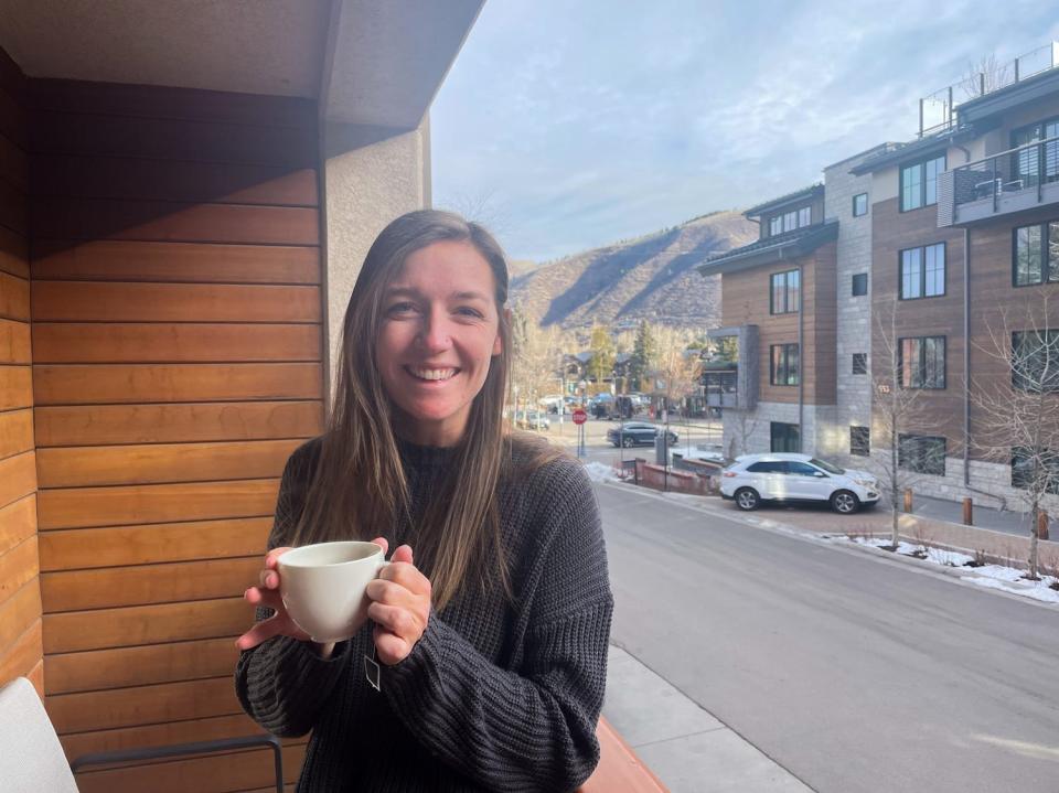 The author on the balcony at The Little Nell hotel in Aspen, Colorado.