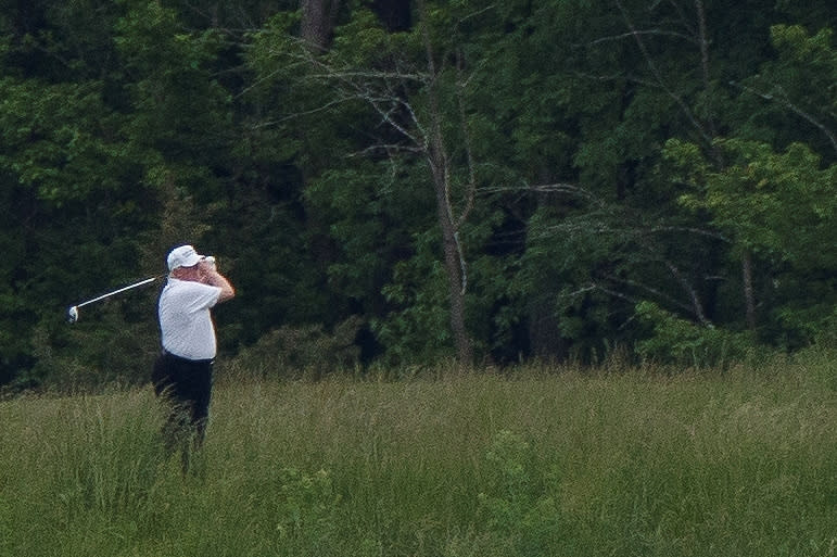 U.S. President Donald Trump participates in a round of golf at the Trump National Golf Course in Sterling, Virginia