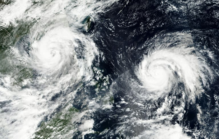 A NASA handout image shows Typhoon Sarika (L) approaching southern China and Vietnam followed closely by Typhoon Haima