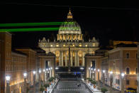 <p>Greenpeace activists project the message “Planet Earth First! ” on the dome of St. Peter’s Basilica at the Vatican, hours ahead of the meeting between President Donald Trump and Pope Francis on May 23, 2017. (Photo: Bente Stachowske/Greenpeace via AP) </p>