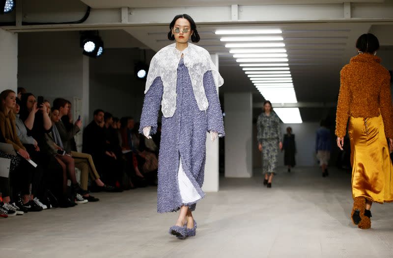 Models present creations during the Yuhan Wang catwalk show at London Fashion Week in London