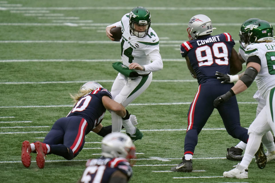 New England Patriots defensive lineman Chase Winovich, left, sacks New York Jets quarterback Sam Darnold in the first half of an NFL football game, Sunday, Jan. 3, 2021, in Foxborough, Mass. (AP Photo/Charles Krupa)