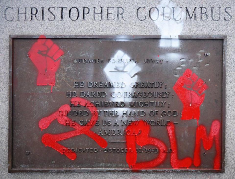 Protesters deface the statue of Christopher Columbus as the small group walk through Bayside and defaced bronze statue of Columbus and Ponce de Leon on Wednesday, June 10, 2020.