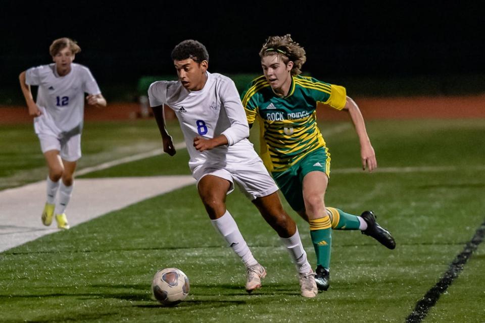 Hickman's Mo Lehmedi (8) runs the sideline while dribbling the ball during a match against Rock Bridge.