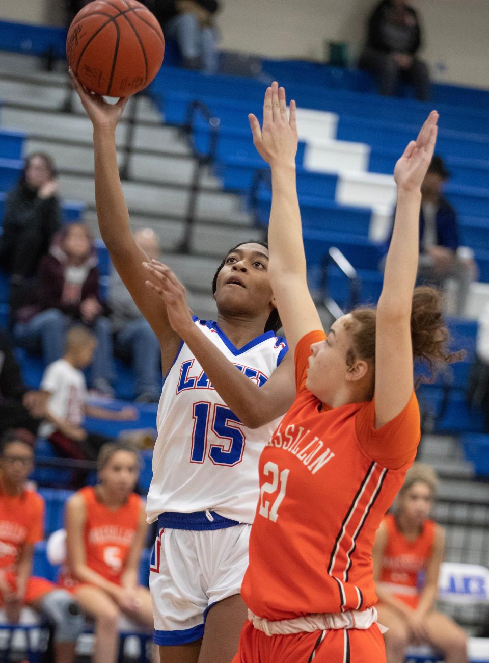 Lake's Serenitee Johnson shoots a layup with defense from Massillon's Makiya Edwards in the first half at Lake Thursday, Dec. 22, 2022.